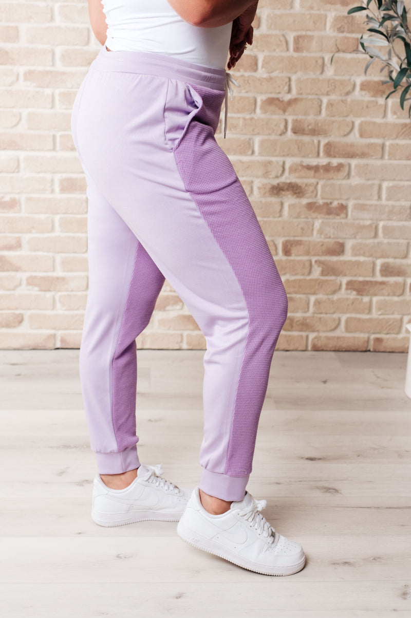 Purple and white joggers on sale