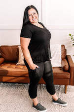 The Last Crossover Capri Leggings With Pockets In Intensive Black By Anchored Arrows